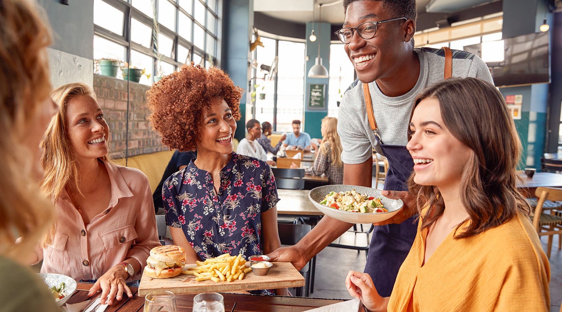 Close to the Center of Everything people eating and laughing