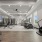 State-of-the-art fitness center with various cardio machines, free weights, and large mirrors on the walls