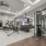 State-of-the-art fitness center with various cardio machines, free weights, and large mirrors on the walls